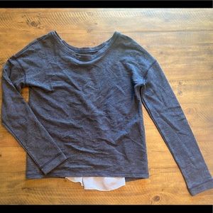 Gray top with sheer back insert.